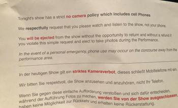 Paper informing us about the cell phone policy: “Tonight’s show has a no camera policy, which includes cell phones....You will be ejected from the show without the opportunity to return....”