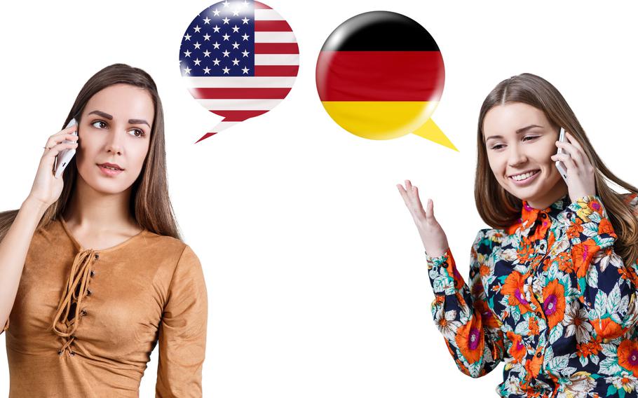 Two women talking on cell phones. One bubble has an American flag and one bubble has German flag.