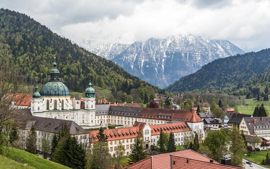 Ornate abbey in a valley.