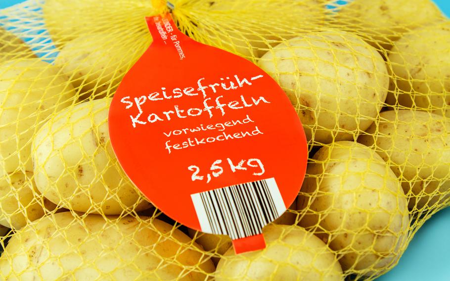 a mesh sack of German vorwiegend festkochend (medium waxy) potatoes with a circular red label