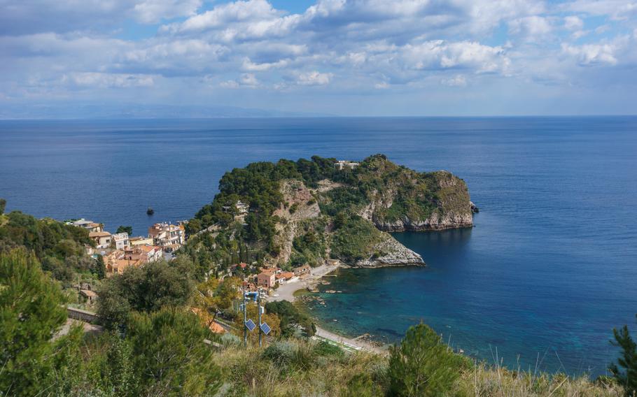 View at coastline in Taormina with clear turquoise water at the mediterranean sea on a sunny day, Sicily, Italy