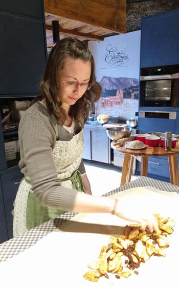 Writer putting the apples into the pastry