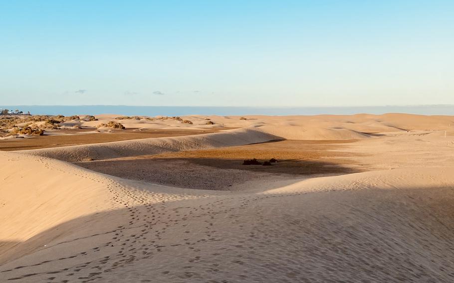 Vast sandy dunes on a sunny day with clear, blue skys