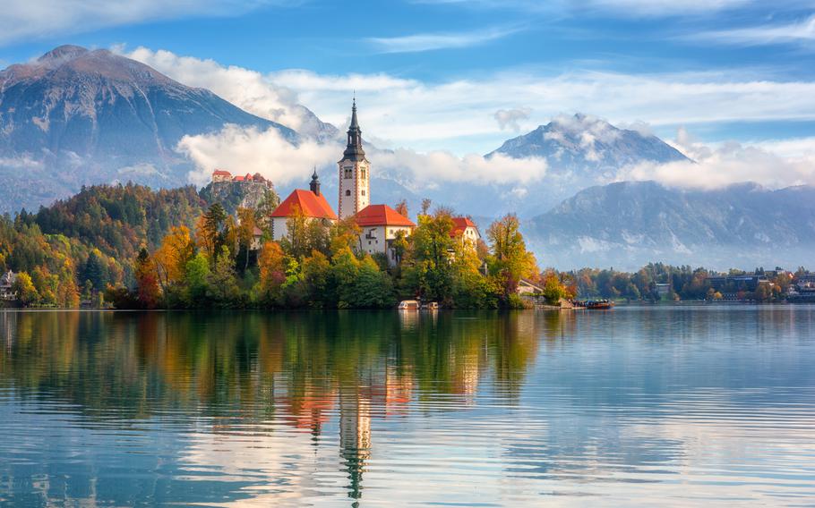 Famous alpine Bled lake (Blejsko jezero) in Slovenia, amazing autumn landscape. Scenic view of the lake, island with church, and Bled castle.