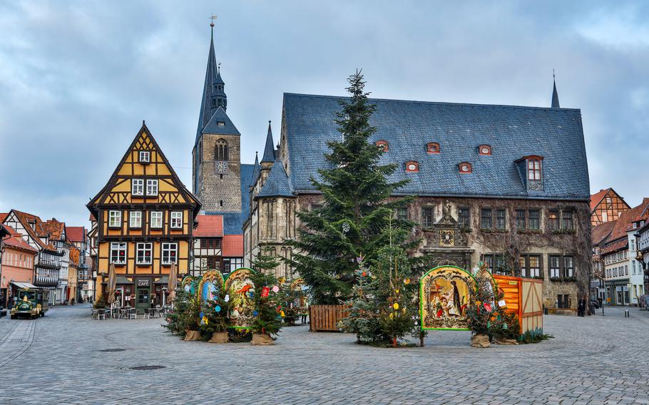 Quedlinburg at Christmas with festive lights, charming half-timbered houses, and a holiday market.