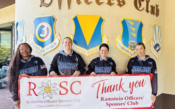Lady Rams Softball team members holding “Thank You” sign