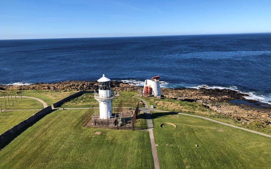 View of old lighthouse and coastline in Fraserburgh