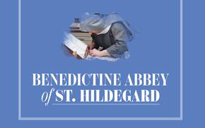 Nun looking down and writing on papers with the words “Benedictine Abbey of St. Hildegard” underneath.