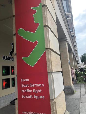 Ampelmann sign reading in white letters on red backgrouns “From East German traffic light to cult figure”