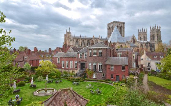An overview of the city of York with the Cathedral in the background and gardens 