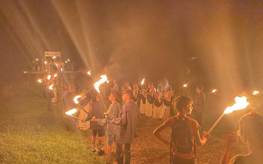 Romans and villagers waiting for Bacchus at the Mosel River dock