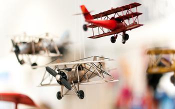 Three old style toy planes with focus on first plane propeller