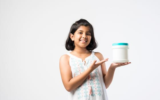 a girl holding her time capsule