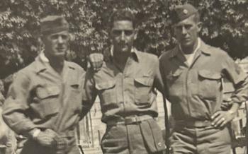 black and white photo of 3 soldiers during wwII