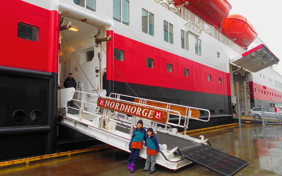 Norwegian ferry boat, the Hurtigruten line’s Nordnorge, and two kids on the gangplank.