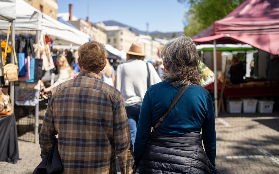 at a market in a city shopping for fresh food and culture with stalls