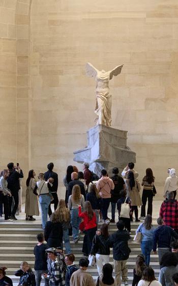 Crowd on steps at the Winged Victory statue