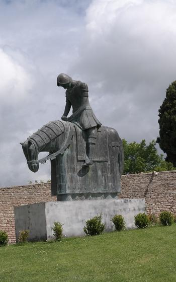 Statue of a knight on horse in Assisi 