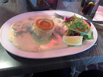 Vol-au-vent: Chicken dish with a pastry in the center with gravy and a salad on the side