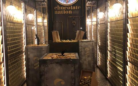 Photo Of Interior of chocolate vault with a sign at the end that reads “Chocolate Nation”