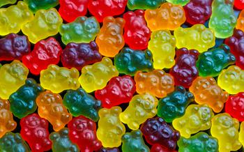 Full-frame  pattern of colorful jelly bears laid closely on flat surface in high angle directly above view