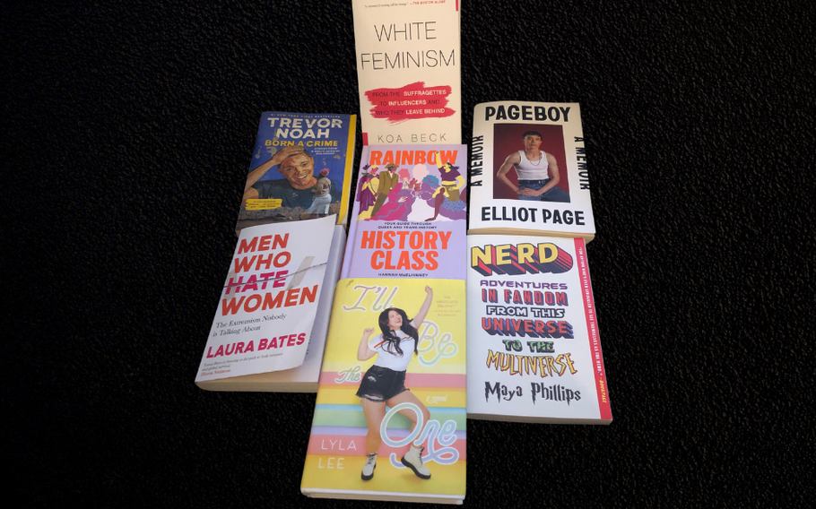 List on books featured in picture: “White Feminism,” “Born a Crime,” Men who Hate Women,” “I’ll be the One,” “Rainbow History Class,” “Pageboy: A Memoir,” and “Nerd Adventures in Fandom.”