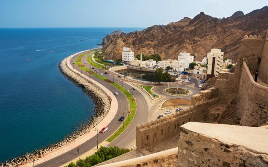 waterfront road under the Corniche of Mutrah in Muscat with cars