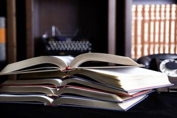 Stack of four open books 