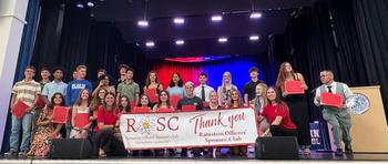Ramstein High School scholarship recipients holding “Thank You” sign