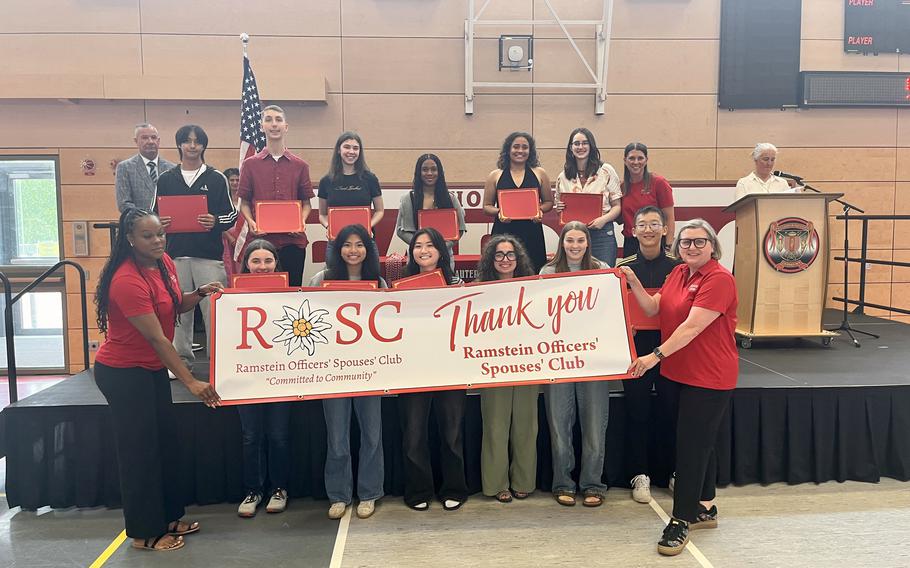 Kaiserslautern High School Award winners holding “Thank You” sign