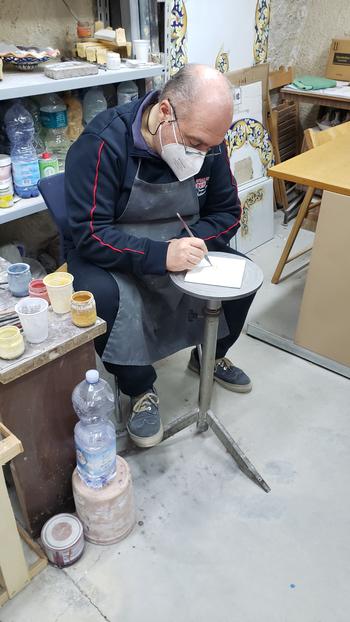 Man working on clay project