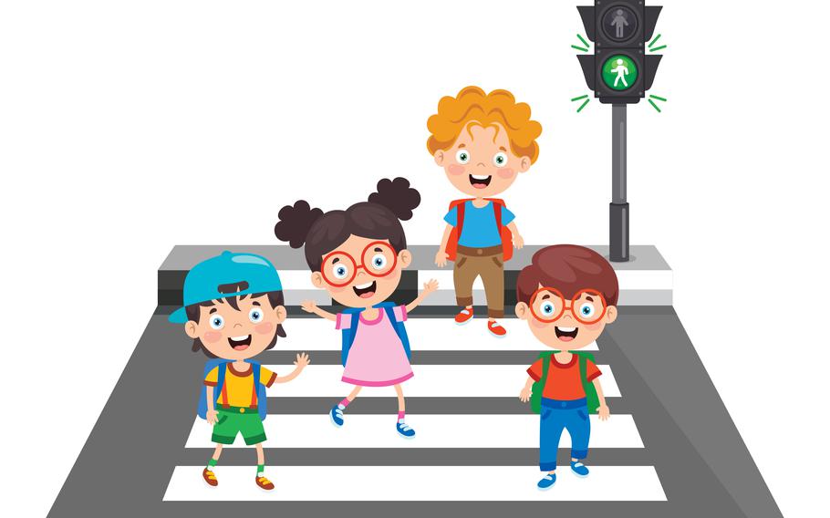 Kids crossing safely when the light is green 