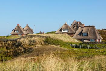 Thatched roof summer houses in the dunes of Hornum, Sylt