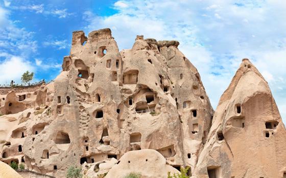 Residential caves in the Cappadocia mountains against the blue sky