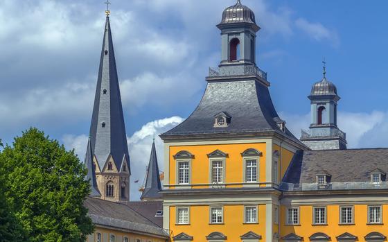 Photo Of Former Prince palace, now is main building of the University of Bonn, Germany | Building is yellow and it is sunny outside