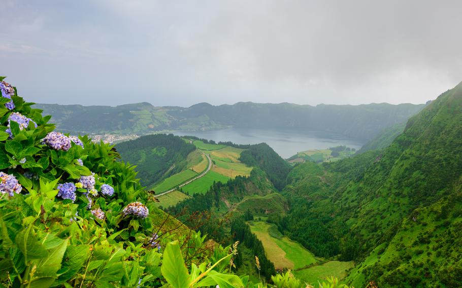 Azores, Portugal. Beautiful lagoons in volcanic craters and green fields. Tourist attraction and travel destination.