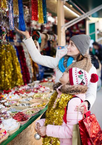 Woman and child looking at items at a stand