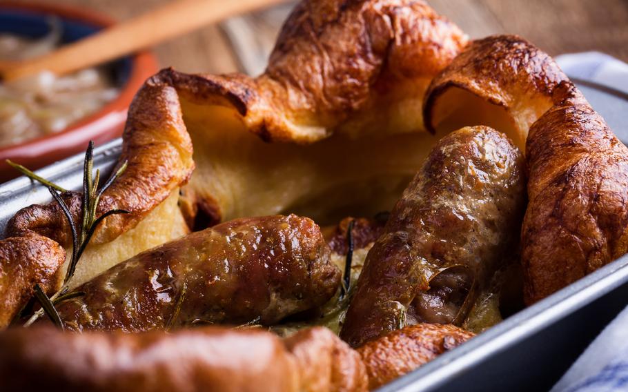 sausages baked in a fluffy, browned yorkshire pudding batter 