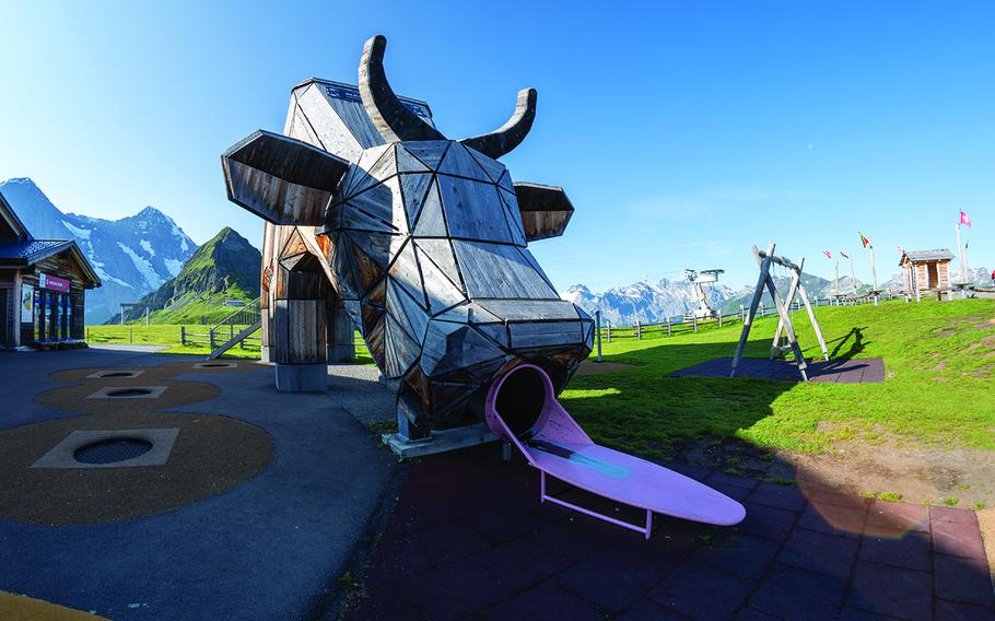 Huge alpine playground featuring a giant cow slide in the Swiss alps - Mannlichen, Switzerland 