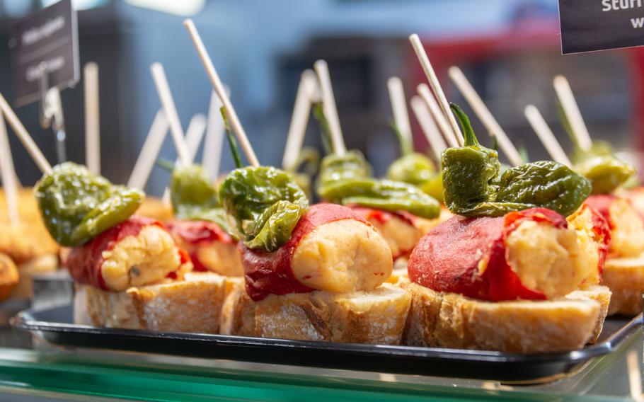 Traditional tapas and pinchos on a counter in a bar in Spain