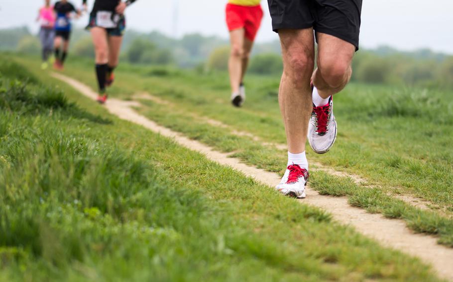 Group of people participating in outdoor cross-country running 