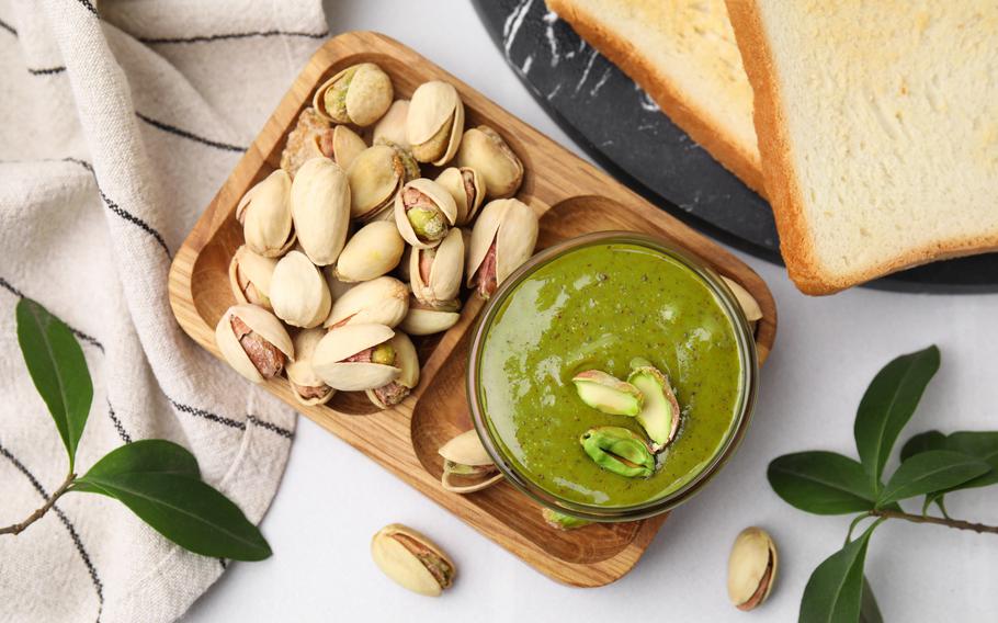 a spread of pistachio creme and pistachio nuts