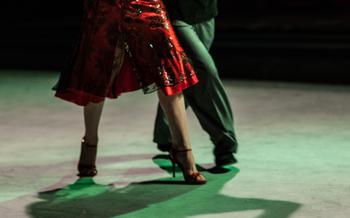 Close up of the legs of two Tango dancers dancing
