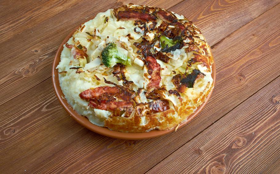 traditional English dish made fried leftover vegetables, potato and brussel sprouts,   cabbages