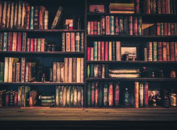 Many books on a large bookshelf