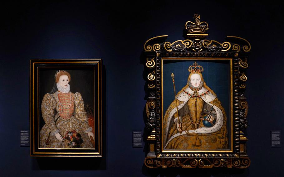 Two portraits of Queen Elizabeth one young, one middle aged drapped in golden dress robes. BOth hang in a golden frame on a dark blue backdrop. Her lips are red in both.