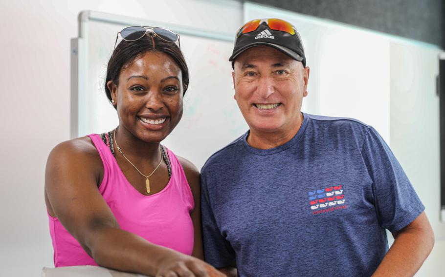 Capt. Monet Green and John Kohut pose for a photo while unpacking various teachers’ belongings before the official opening of the new high school. 