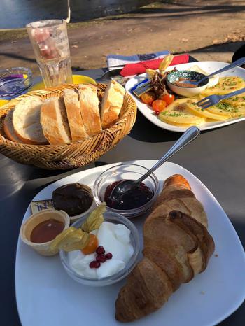 Croissant with jam and marmalade | basket of bread | plate with cheese