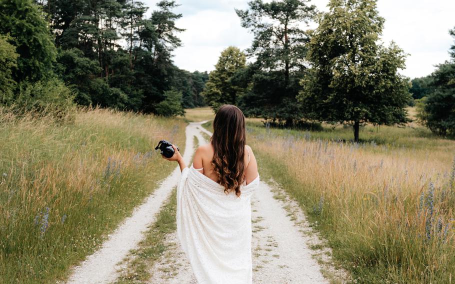 Woman walking with camera