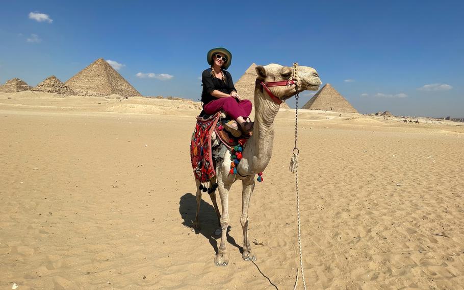 Posing on a camel at the Giza Pyramids